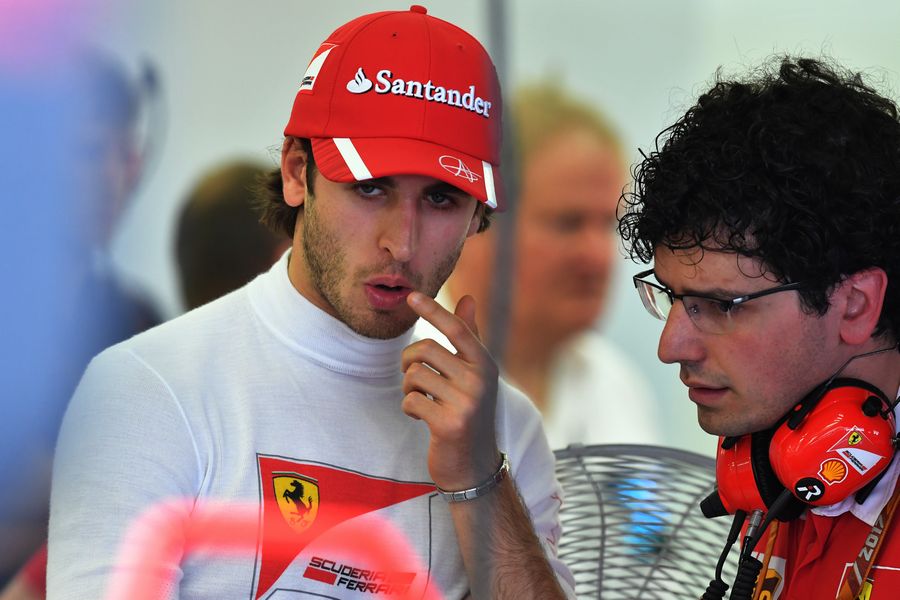 Antonio Giovinazzi talks with Ferrari engineers