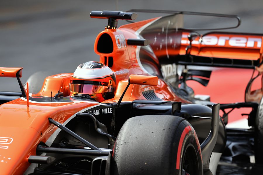 Stoffel Vandoorne powers down the pit lane in the McLaren