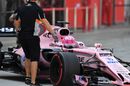 Force India mechanics wheel Esteban Ocon back into the garage