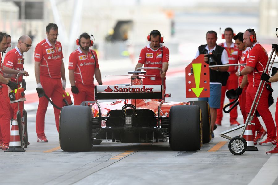 Sebastian Vettel returns to the pitbox