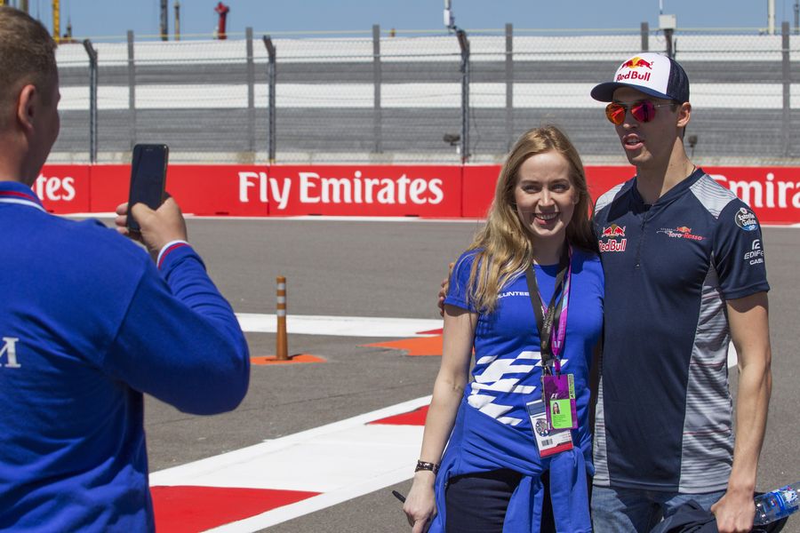 Daniil Kvyat poses for a photograph with the fans