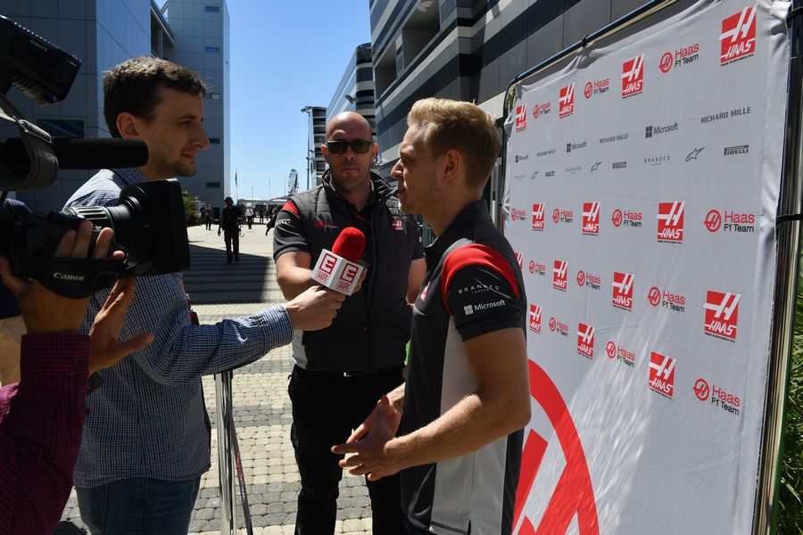 Kevin Magnussen talks with the media