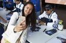 Felipe Massa poses for a photograph with the fans
