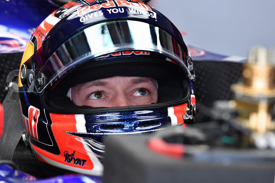 Daniil Kvyat sits in the Toro Rosso cockpit in the garage