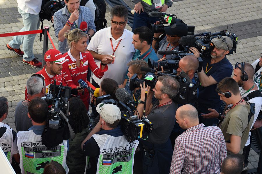 Sebastian Vettel talks with the media