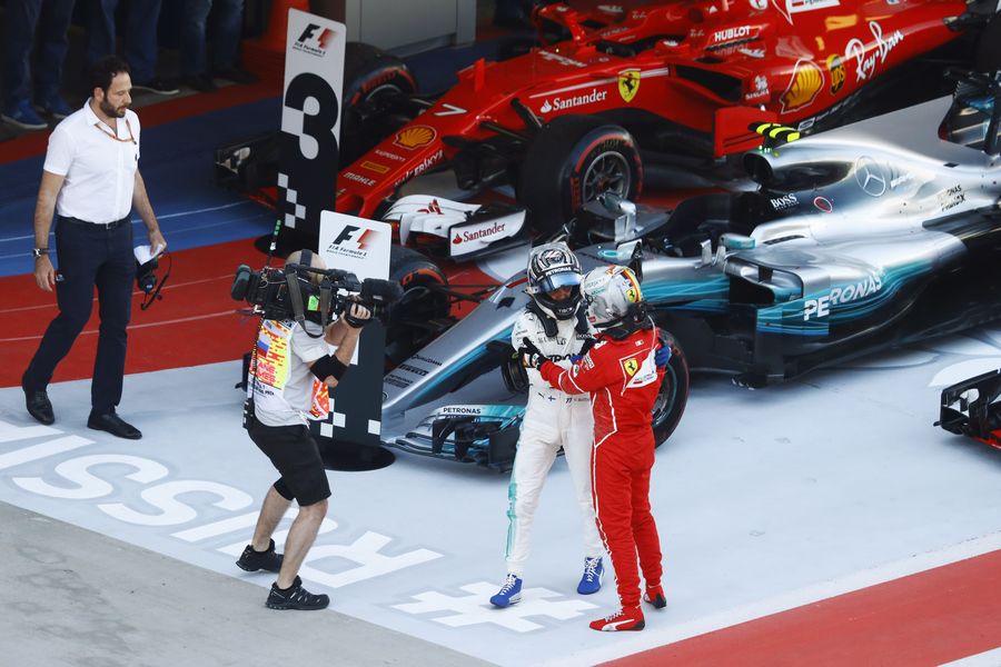 Race winner Valtteri Bottas celebrates in parc ferme with Sebastian Vettel