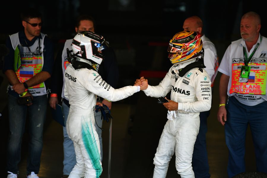 Race winner Valtteri Bottas celebrates in parc ferme with Lewis Hamilton