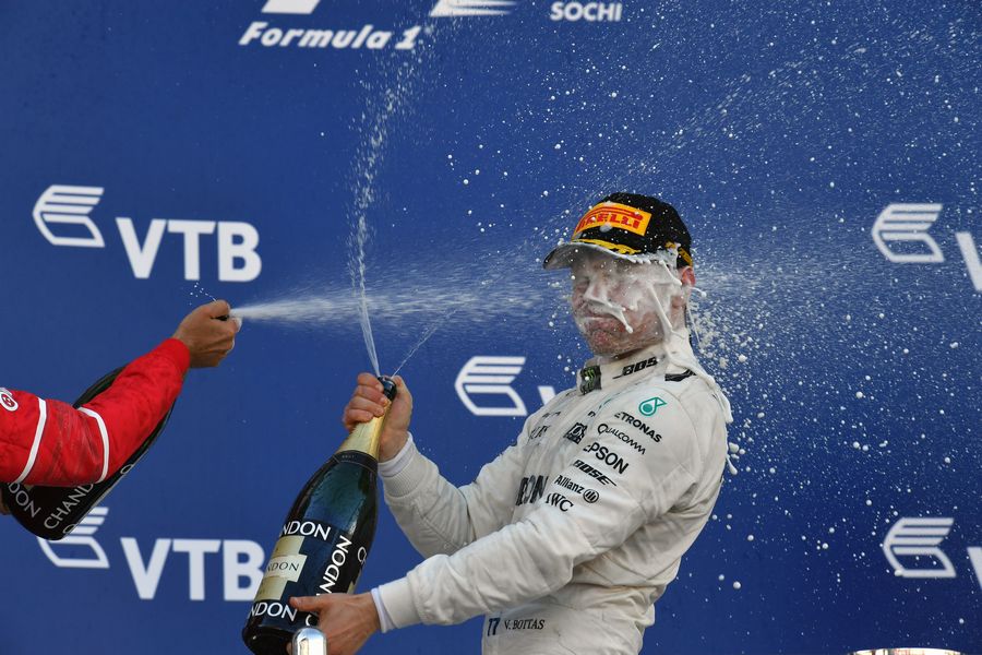 Valtteri Bottas celebrate on the podium with the champagne