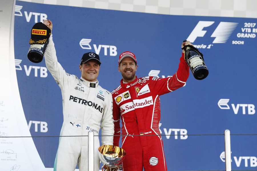 Valtteri Bottas and Sebastian Vettel celebrate on the podium