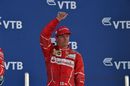 Kimi Raikkonen celebrates on the podium