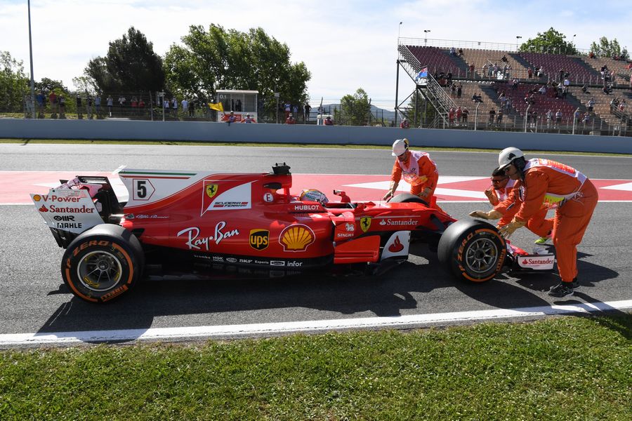 Sebastian Vettel stops at the end of pit lane in FP1