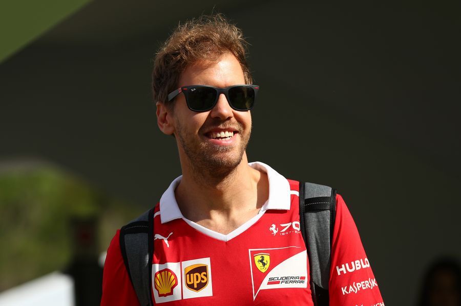 Sebastian Vettel looks relaxed in the paddock