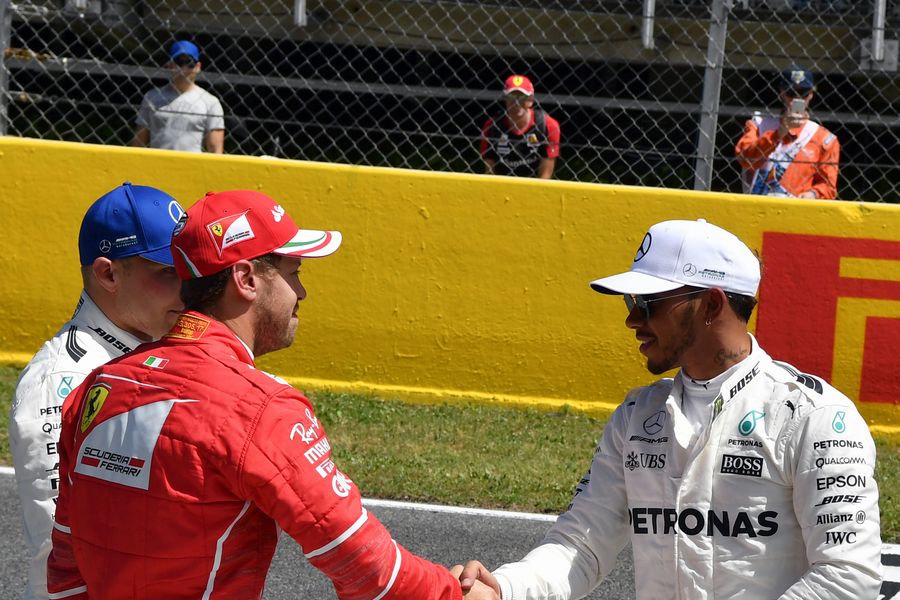 Pole sitter Lewis Hamilton and Sebastian Vettel on the grid