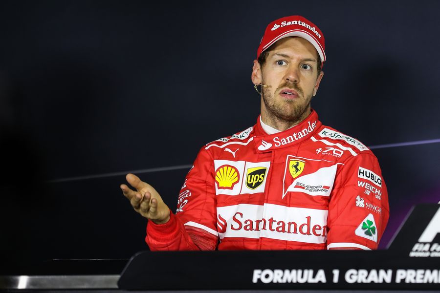 Sebastian Vettel talks with media