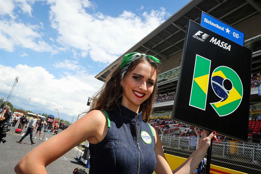 A grid girl poses ahead of the race