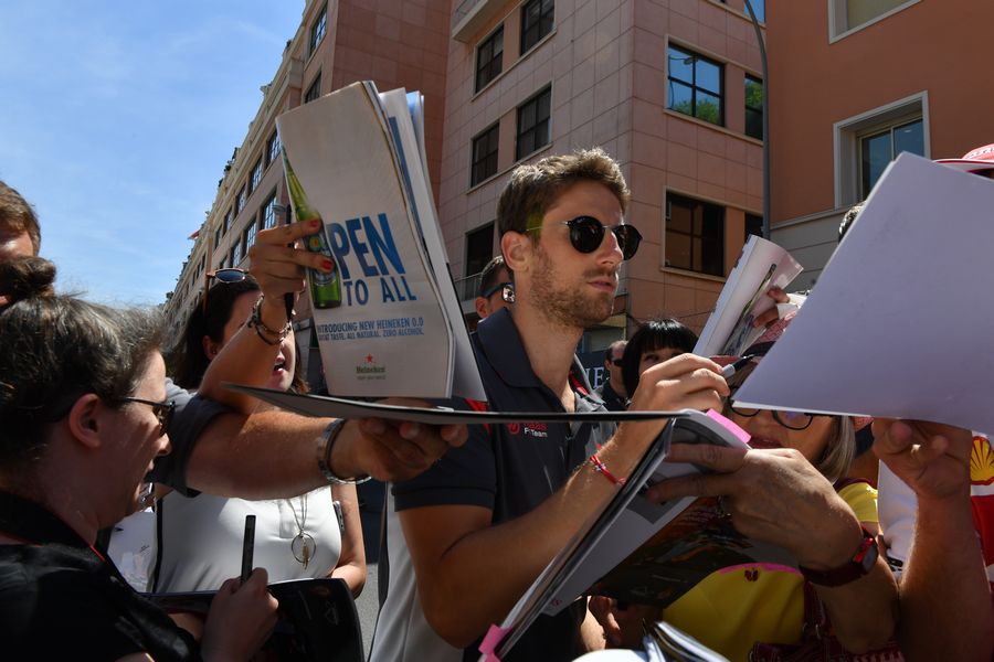 Romain Grosjean signs autograph for a fans