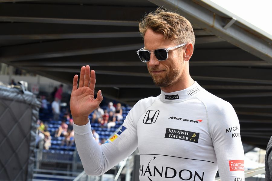 Jenson Button waves to fans