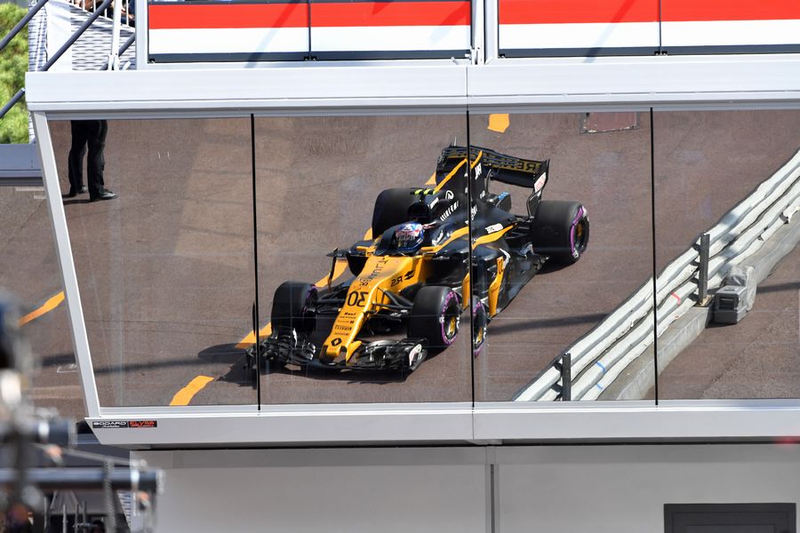 Jolyon Palmer powers down the pit lane in the Renault