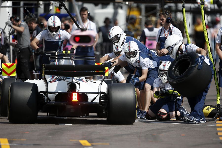 Lance Strollmakes a pit stop during the FP3