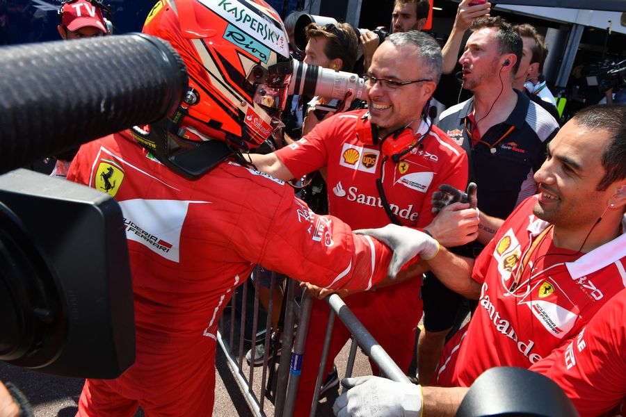 Kimi Raikkonen cerebrates with Ferrari