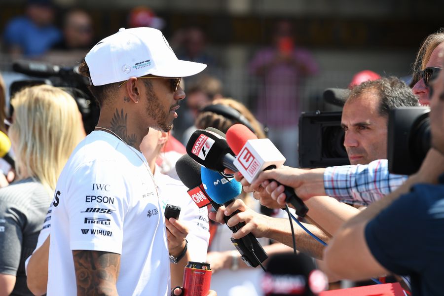 Lewis Hamilton talks with media