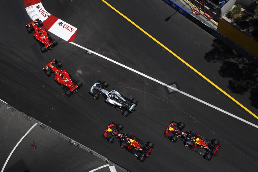 Kimi Raikkonen leads Sebastian Vettel at the start of the race