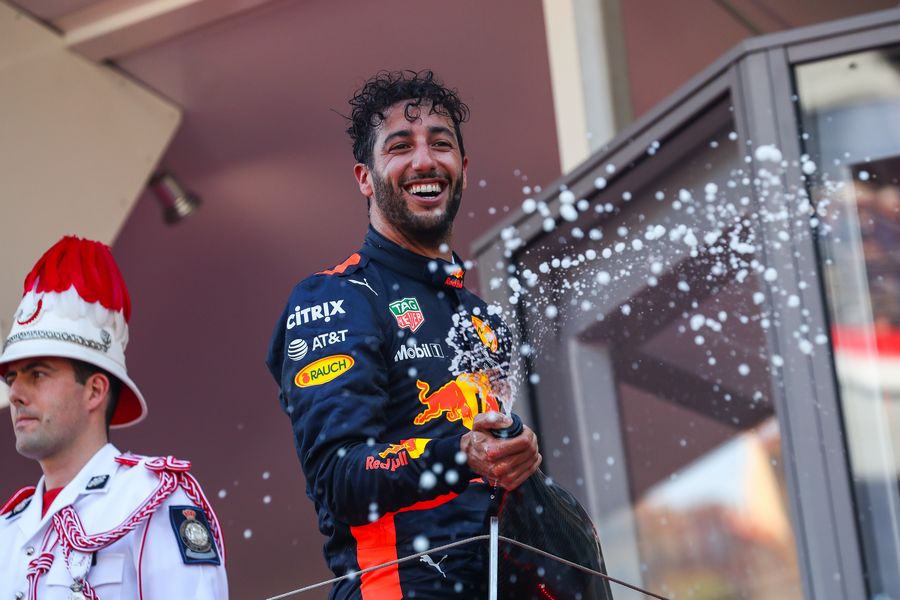 Daniel Ricciardo celebrates on the podium with the champagne