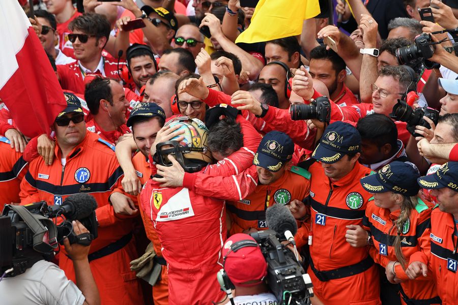 Sebastian Vettel cerebrates with Ferrari
