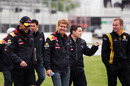 Sebastian Vettel shares a joke with his race engineers