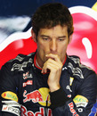 A pensive Mark Webber in the pits during free practice 1