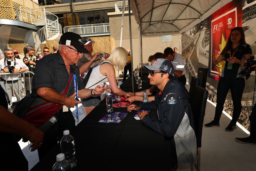 Carlos Sainz jr signs autographs for the fans