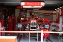 Ferrari mechanic works on the SF70-H floor