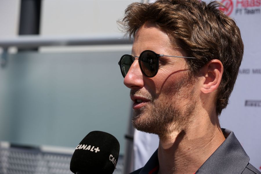 Romain Grosjean talks with media