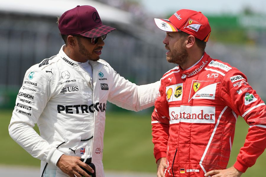 Lewis Hamilton talks with Sebastian Vettel in parc ferme