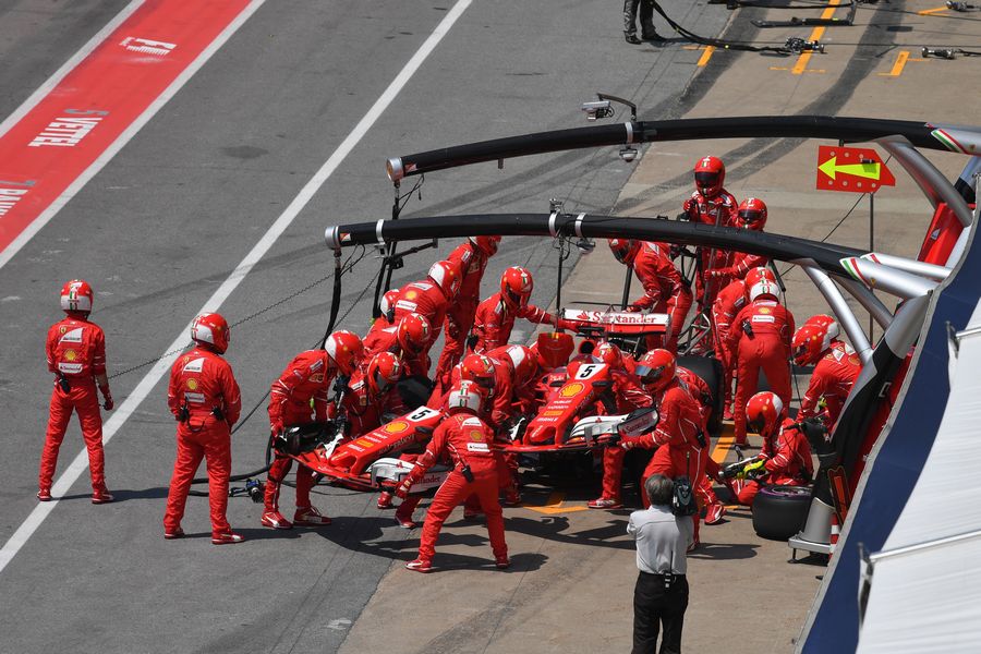 Sebastian Vettel pits with a broken front wing