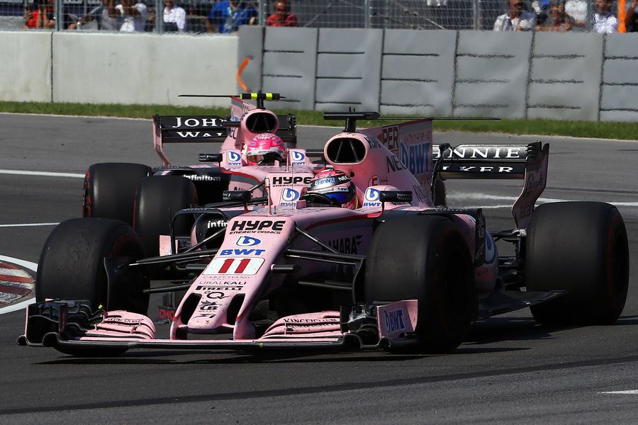 Sergio Perez leads Esteban Oconin the Force India