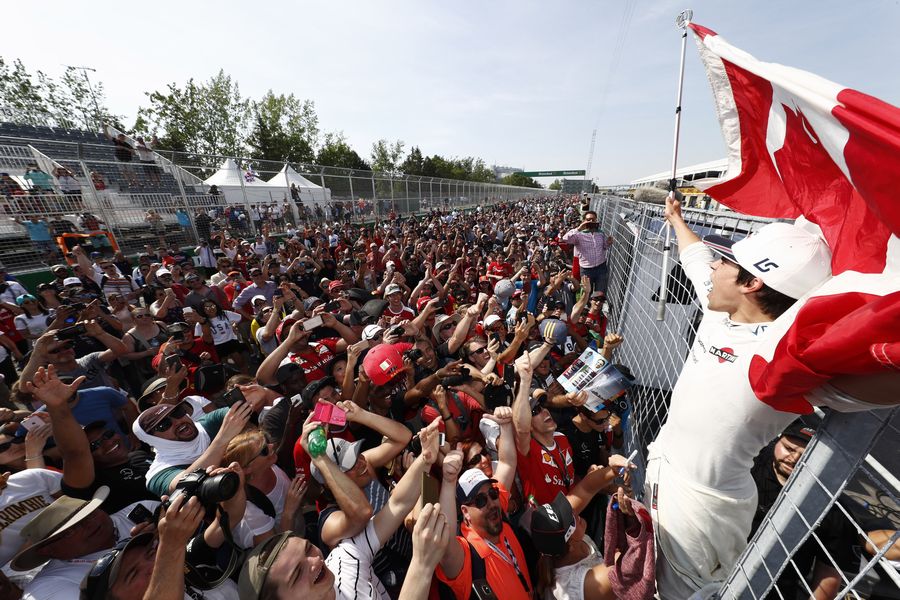 Ninth place finisher Lance Stroll s celebrates with the fans