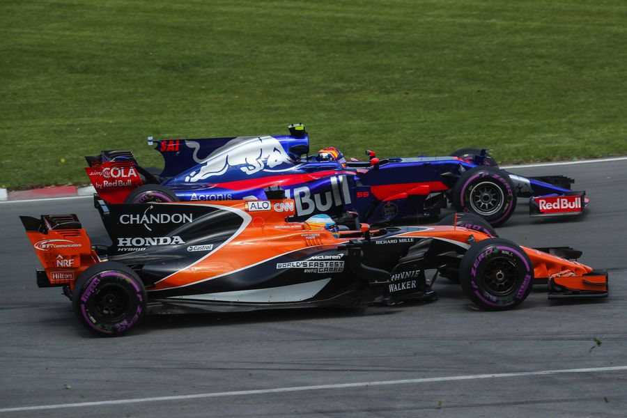 Fernando Alonso and Carlos Sainz jr battle
