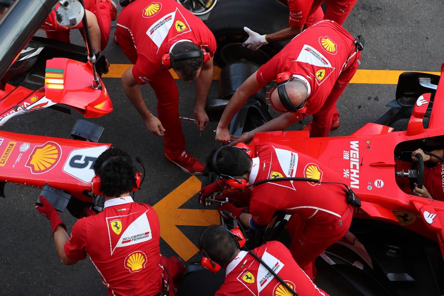 Ferrari mechanics make a practice pit stop