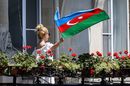 Girl waves Azerbaija flag