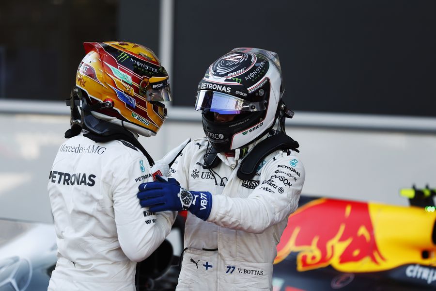 Pole sitter Lewis Hamilton and Valtteri Bottas in parc ferme