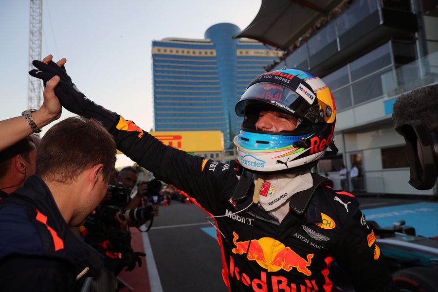 Race winner Daniel Ricciardo celebrates in parc ferme with the team