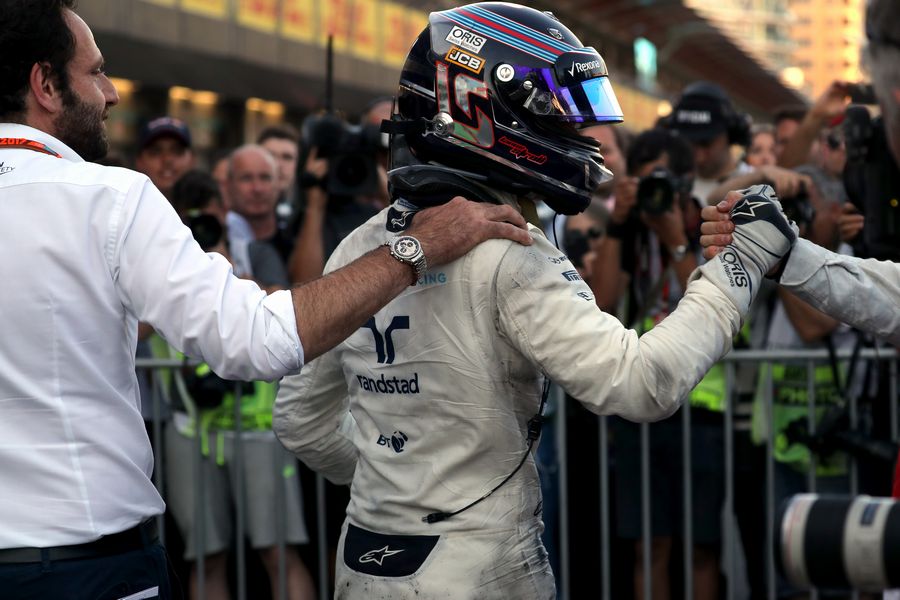 Lance Stroll celebrates in parc ferme with the team