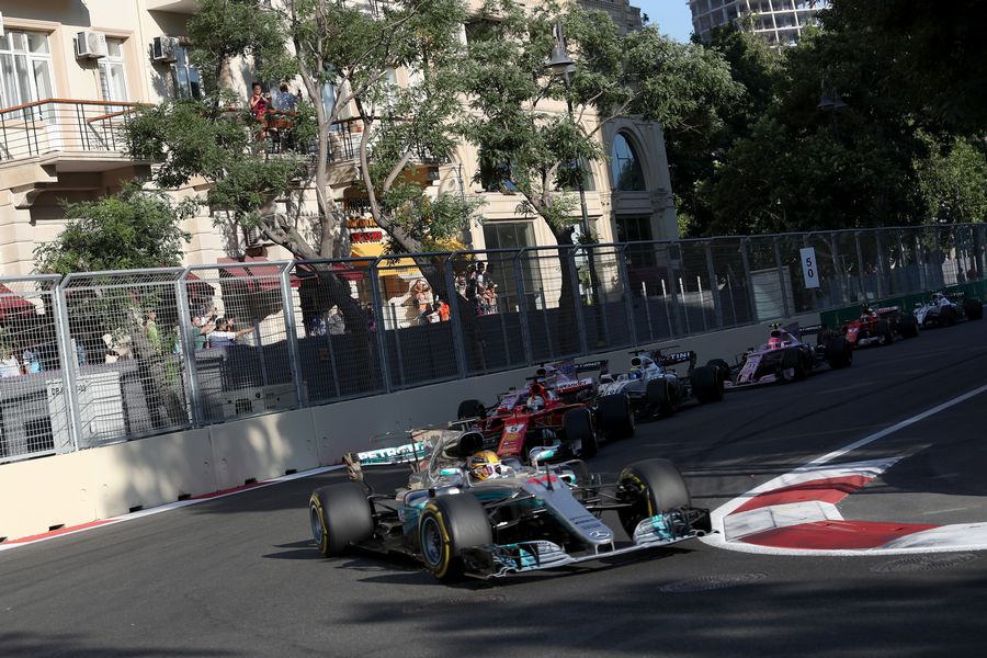 Lewis Hamilton leads Sebastian Vettel at the restart