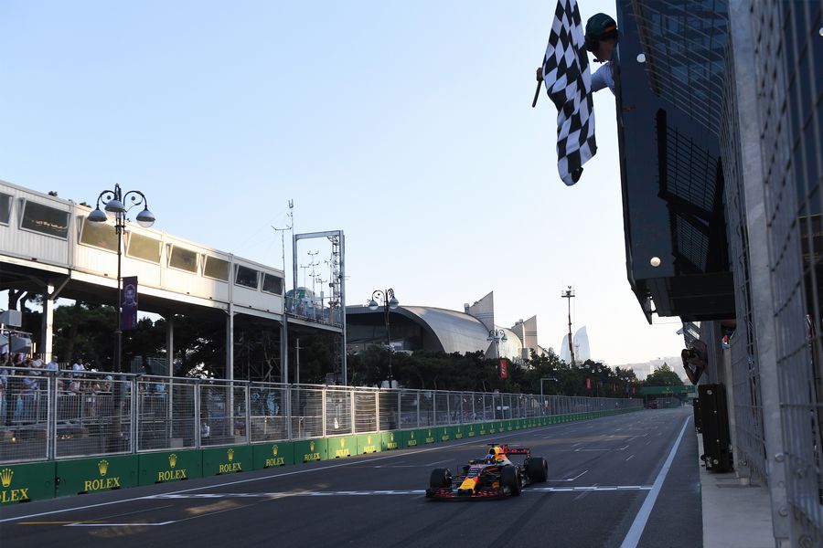 Race winner Daniel Ricciardo takes the chequered flag