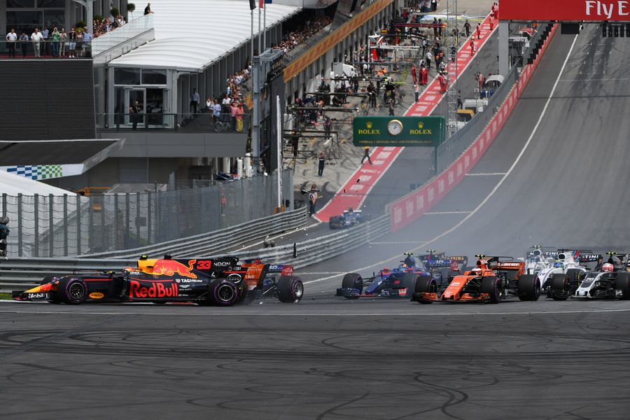 Max Verstappen collides at the start of the race