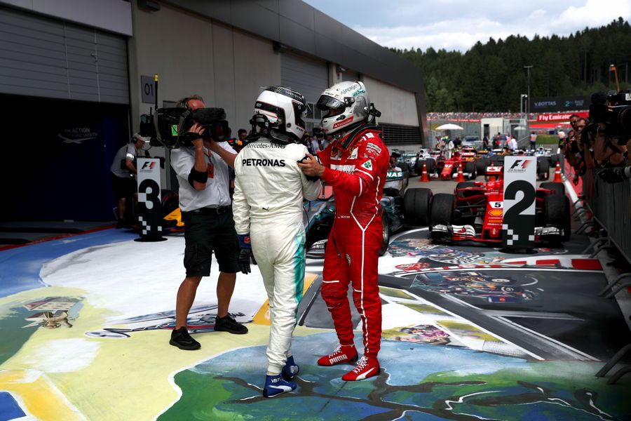 Race winner Valtteri Bottas and Sebastian Vettel celebrate in parc ferme