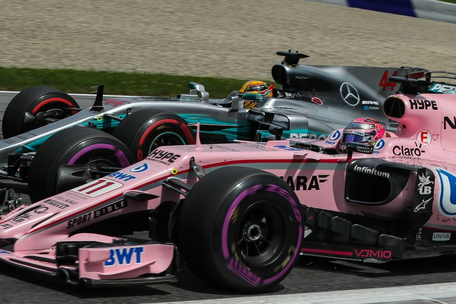 Lewis Hamilton and Esteban Ocon battle for position