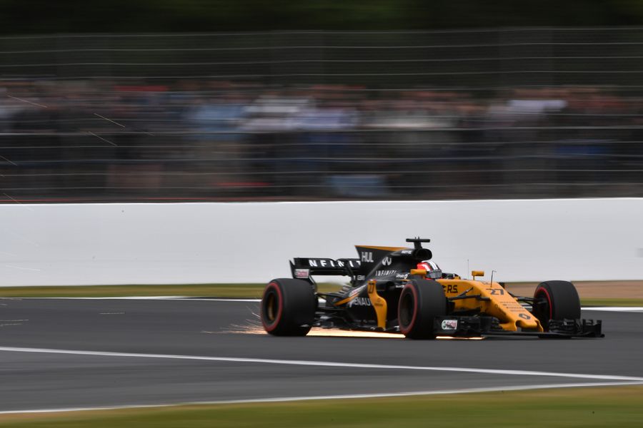 Sparks fly from Nico Hulkenberg's Renault
