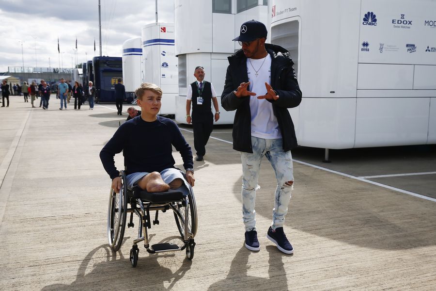 Lewis Hamilton and Billy Monger at the paddock